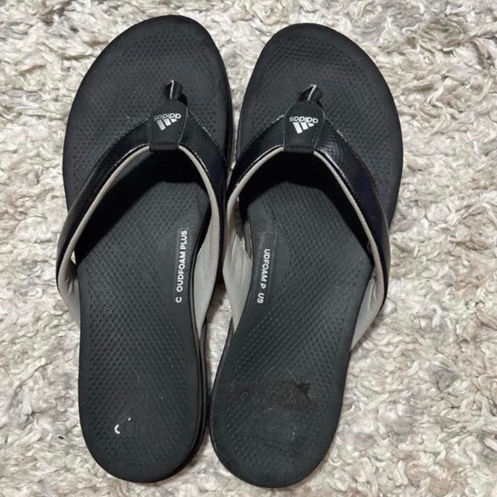 Women’s well worn adidas flip flops